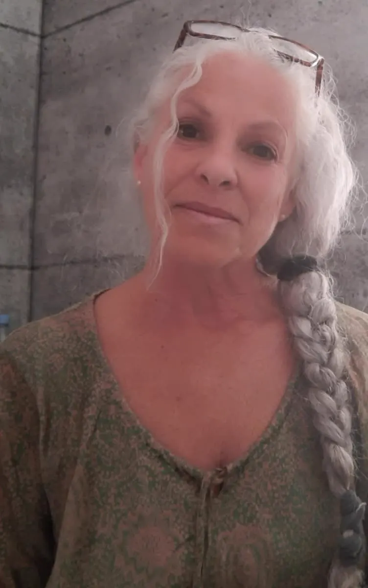 Portrait of a woman with long braided white hair