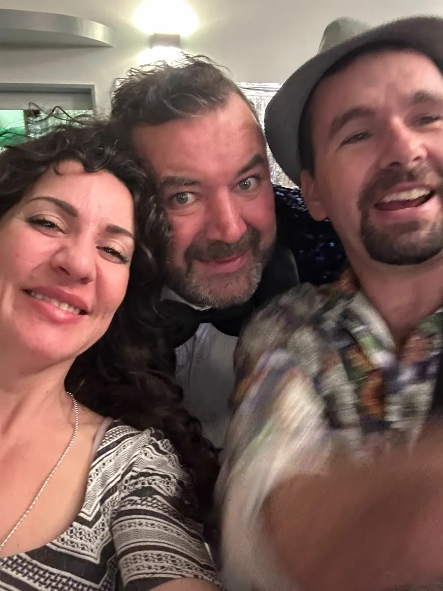 Selfie of three people at a party